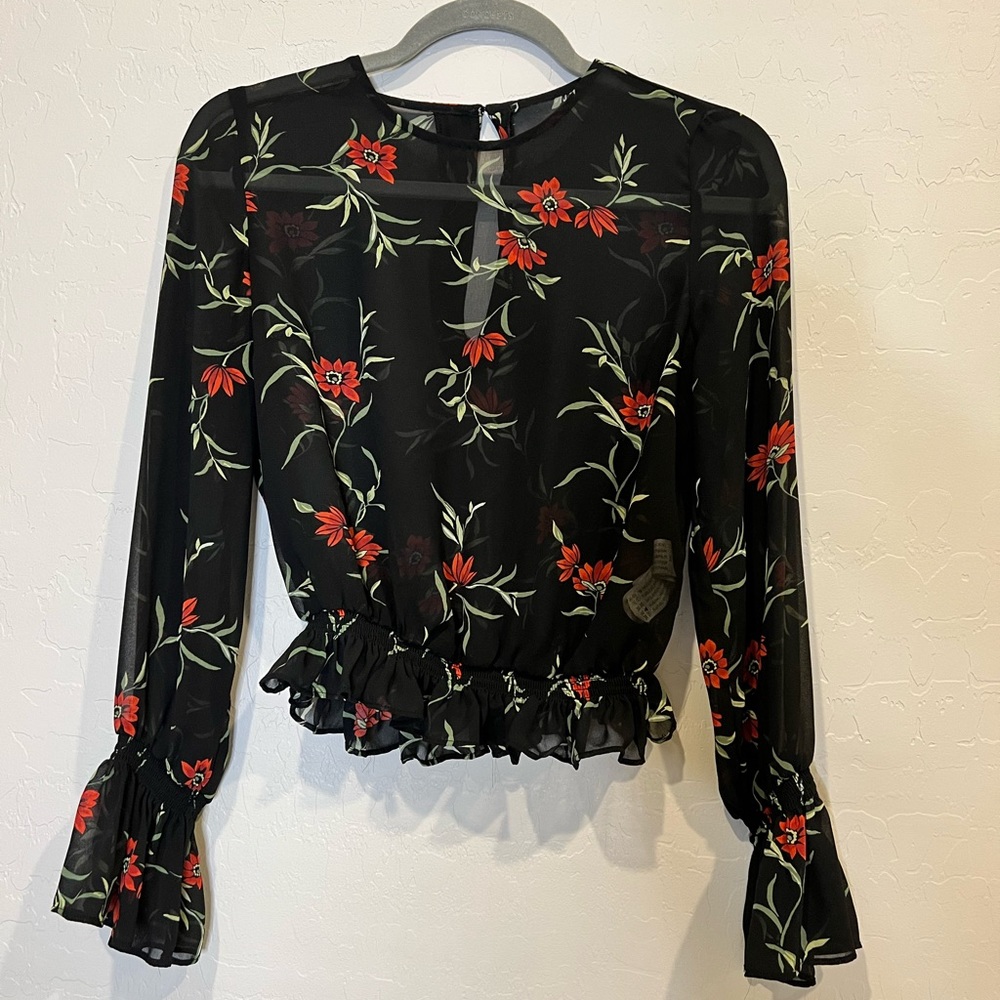 Sheer flower print blouse.